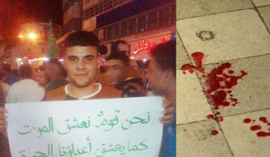 Nur A-Din Abu Hashya, the stabbing suspect, shown here accidentally holding a placard calling for violence against Jews.