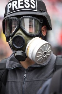 reporter in gas mask