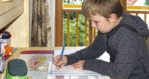 Child With Summer Homework Almost Ready For Final Push To Avoid It