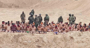 Weather Not Quite Warm Enough For Captured-Terrorists-Handcuffed-In-Underwear Group Purim Costume