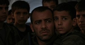 Terrorist Hiding Behind Civilians Taunts IDF To ‘Come Fight Like Real Men’